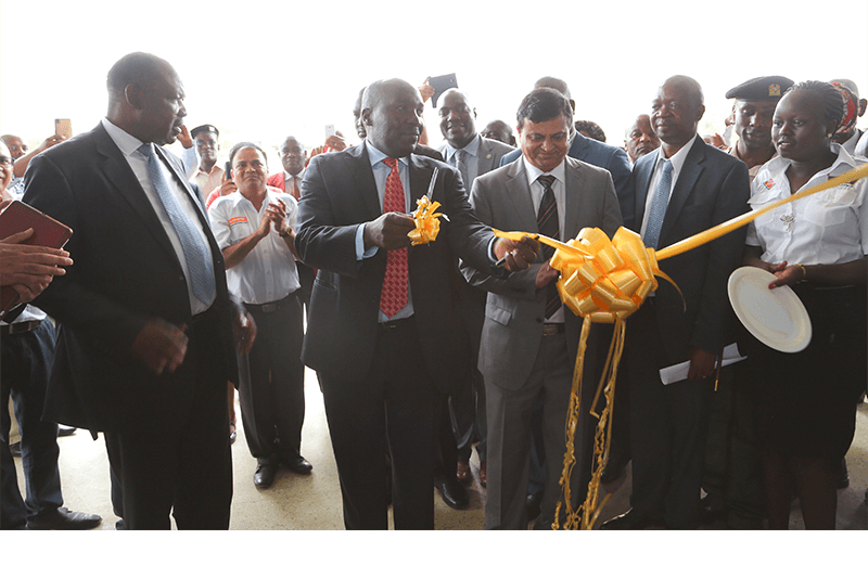 His Excellency the Governor of Kisumu, Hon Jack Raguma (left), State Department of industry and Enterprise Development - Principle Secretary, Julius Korir (centre) and Crown Paints CEO, Rakesh Rao cut a ribbon to officially open the new Crown Paints Factory in Kisumu City.