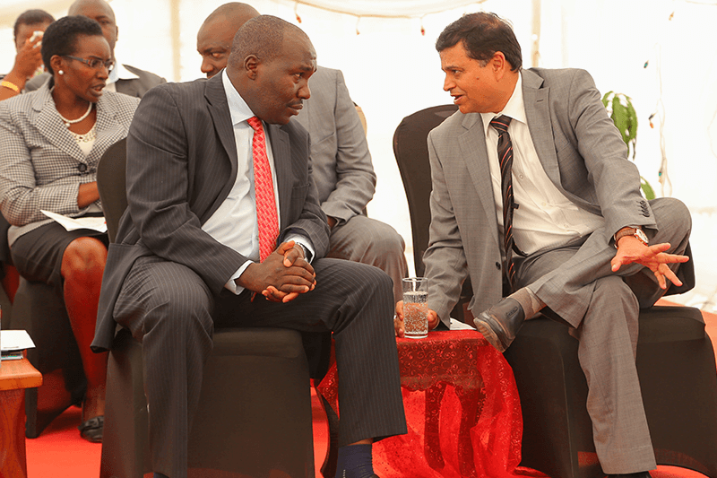 Crown Paints CEO, Rakesh Rao interacts with State Department of industry and Enterprise Development - Principle Secretary, Julius Korir, moments after the official opening of a new Crown Paints factory in Kisumu.